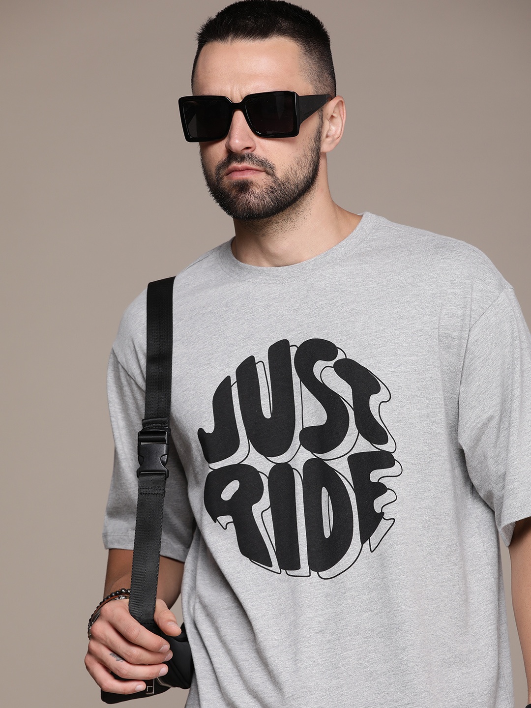 The Roadster Lifestyle Co. Oversized Fit Typography Printed Drop-Shoulder Sleeves Pure Cotton T-shirt, Grey melange
The Roadster Lifestyle Co. Oversized Fit Typography Printed Drop-Shoulder Sleeves Pure Cotton T-shirt, Grey melange