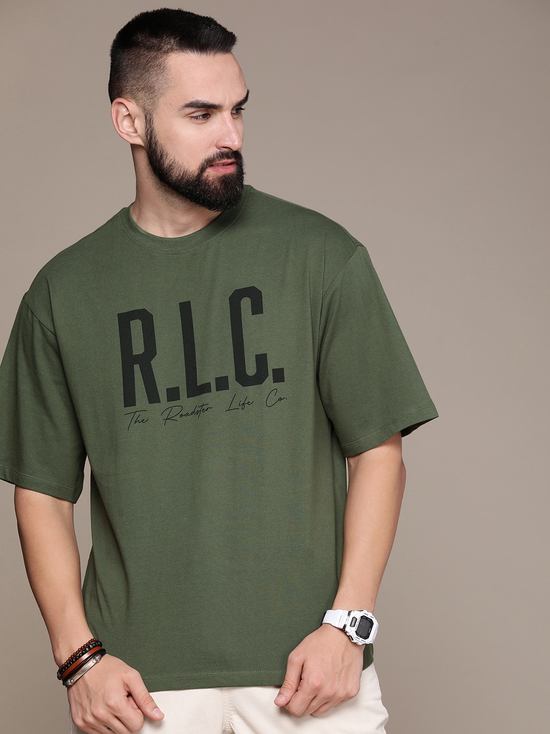 The Roadster Lifestyle Co. Oversized Fit Typography Printed Drop-Shoulder Sleeves Pure Cotton T-shirt, Olive
The Roadster Lifestyle Co. Oversized Fit Typography Printed Drop-Shoulder Sleeves Pure Cotton T-shirt, Olive