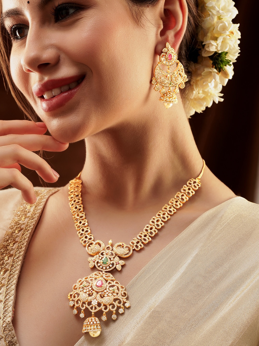 Rubans 22K Gold Plated Peacock Motif Ruby Emerald & CZ Studed with Pearl Bead Jewellery Set
Rubans 22K Gold Plated Peacock Motif Ruby Emerald & CZ Studed with Pearl Bead Jewellery Set