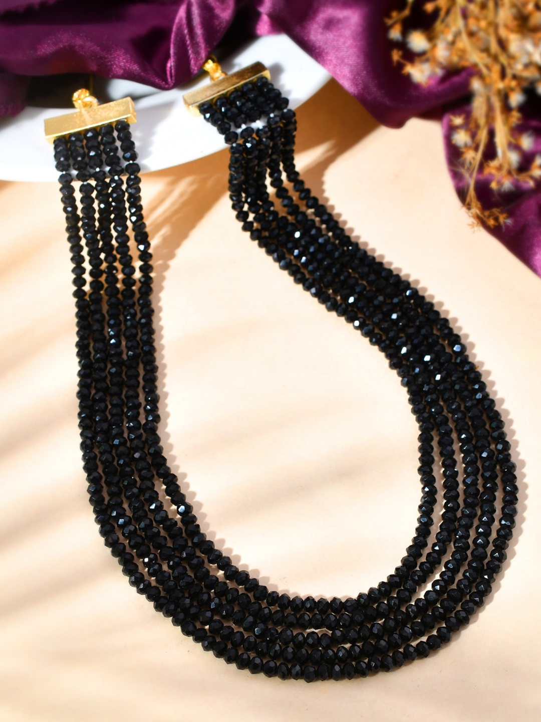 Sanjog Women Gold-Toned & Black Brass Gold-Plated Crystal Beaded Stone 5 Layered Necklace
Sanjog Women Gold-Toned & Black Brass Gold-Plated Crystal Beaded Stone 5 Layered Necklace
