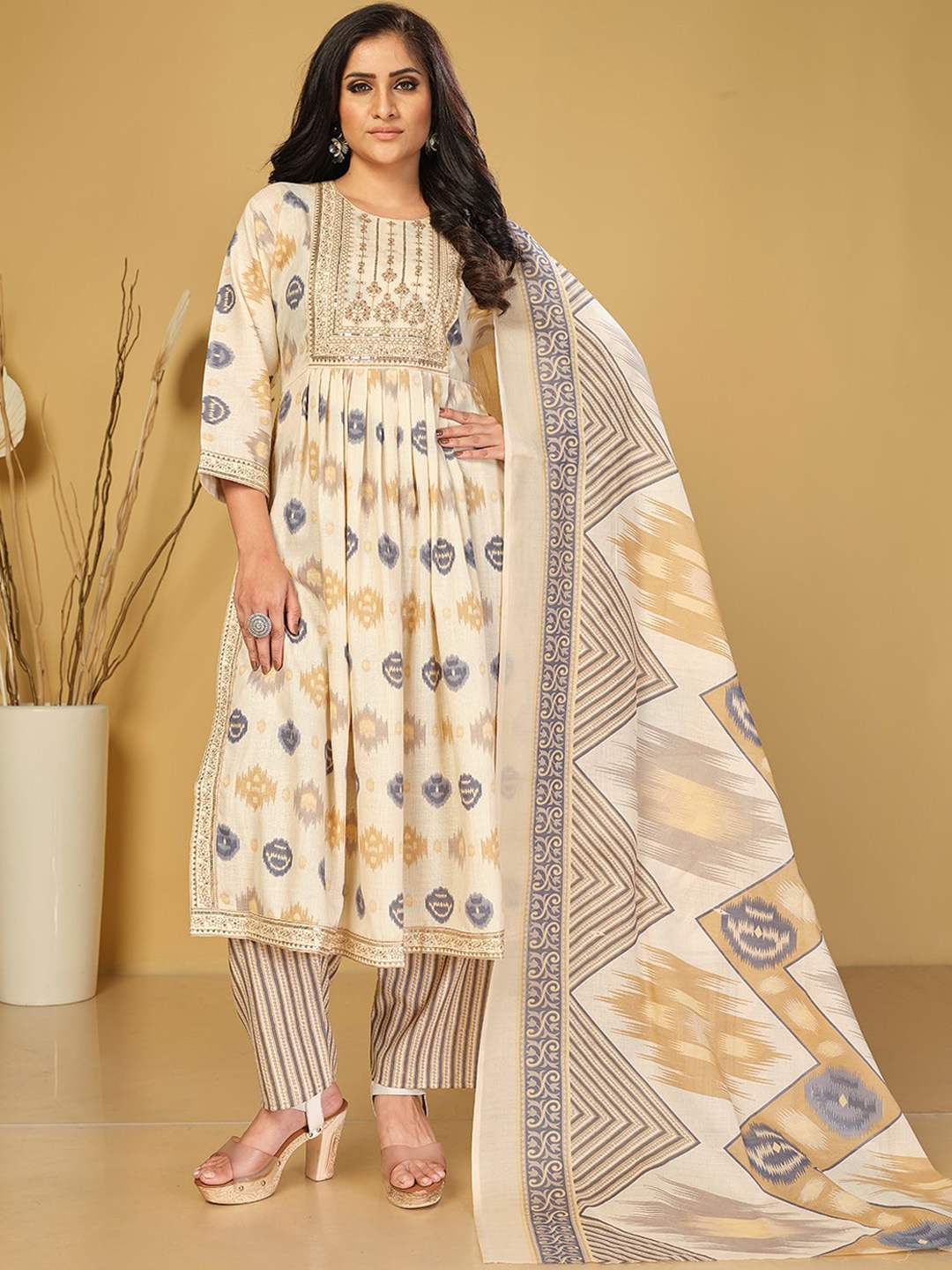 KALINI Ethnic Motifs Printed High Slit Sequinned Kurta with Trousers & With Dupatta, Beige
KALINI Ethnic Motifs Printed High Slit Sequinned Kurta with Trousers & With Dupatta, Beige