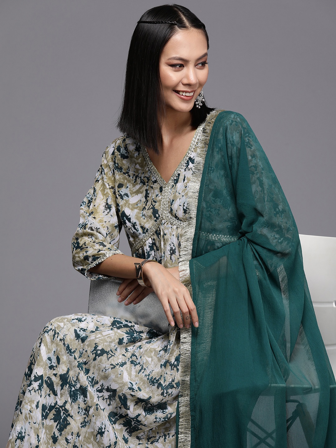 Varanga Women Printed Pleated Silk Georgette Kurta with Trousers & Dupatta, Beige
Varanga Women Printed Pleated Silk Georgette Kurta with Trousers & Dupatta, Beige