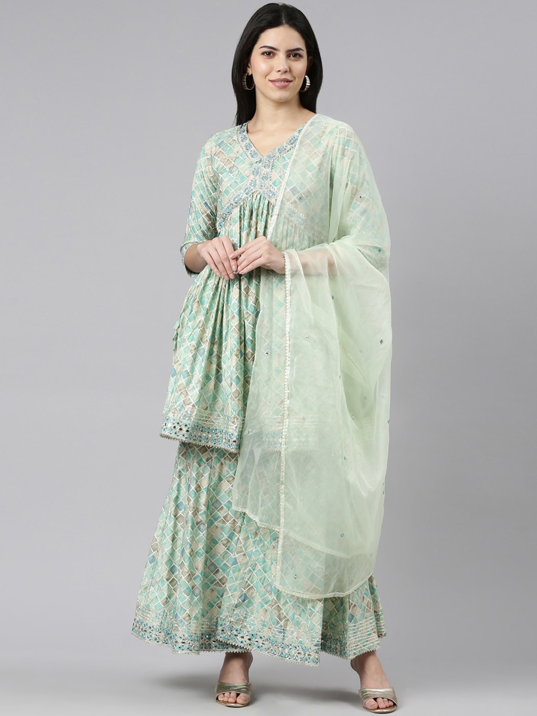 Neerus Geometric Printed V-Neck Pleated Mirror Work Kurta with Sharara & Dupatta, Sea green
Neerus Geometric Printed V-Neck Pleated Mirror Work Kurta with Sharara & Dupatta, Sea green
