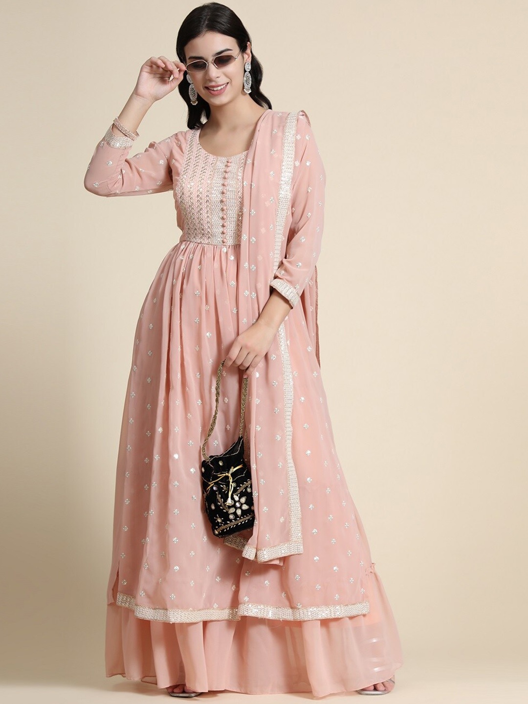 BLACK SCISSOR Ethnic Motifs Embroidered Pleated Georgette Kurta with Sharara & Dupatta, Peach
BLACK SCISSOR Ethnic Motifs Embroidered Pleated Georgette Kurta with Sharara & Dupatta, Peach