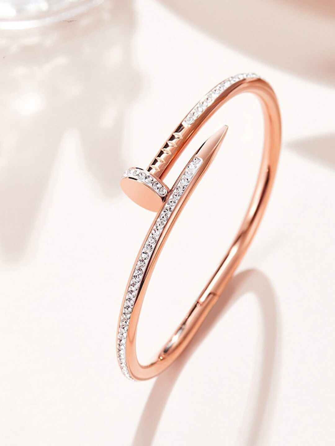 Designs & You Rose Gold-Plated American Diamond Stainless Steel Bangle-Style Bracelet
Designs & You Rose Gold-Plated American Diamond Stainless Steel Bangle-Style Bracelet