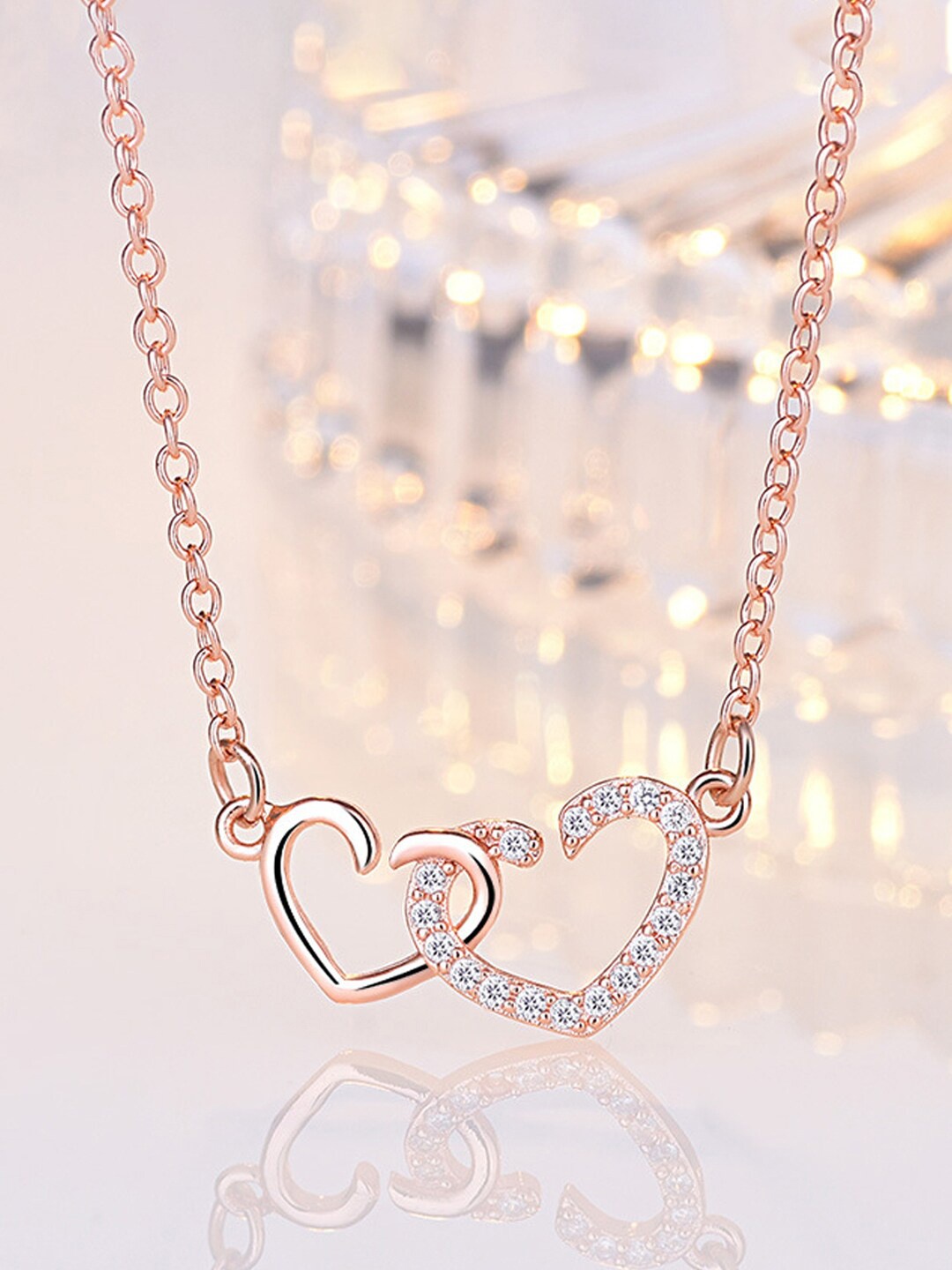Jewels Galaxy Rose Gold-Plated American Diamonds Studded Dual Heart Contemporary Necklace
Jewels Galaxy Rose Gold-Plated American Diamonds Studded Dual Heart Contemporary Necklace