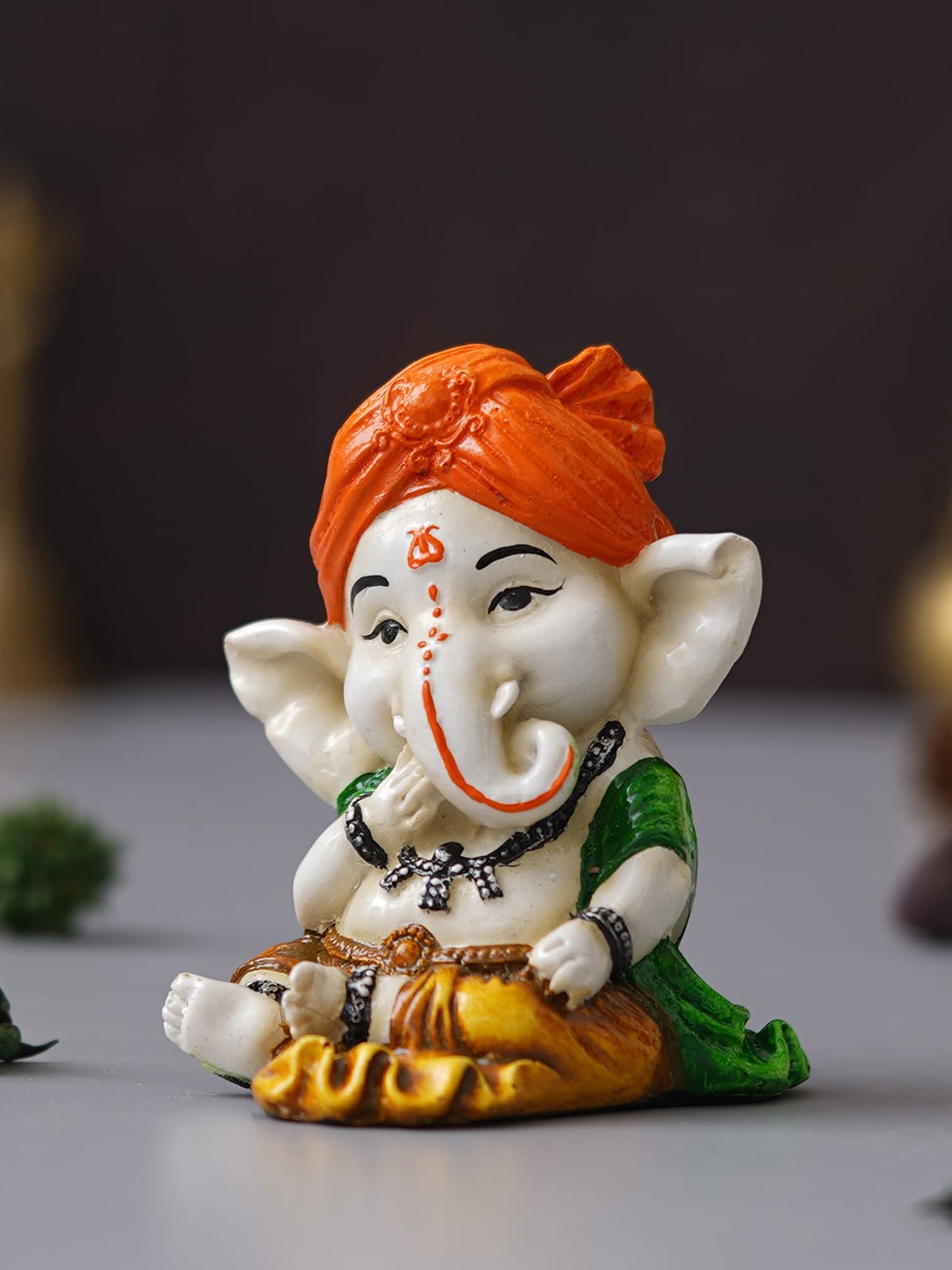 eCraftIndia Orange & White Eating Lord Ganesha Idol While Sitting Polyresin Showpieces
eCraftIndia Orange & White Eating Lord Ganesha Idol While Sitting Polyresin Showpieces