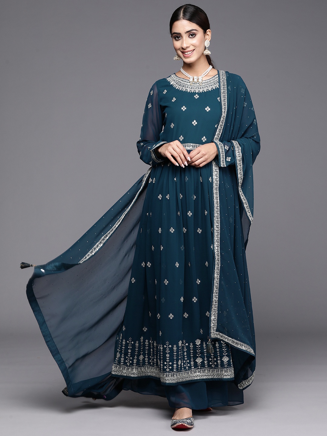 Libas Floral Embroidered High Slit Sequinned Kurta with Palazzos & Dupatta, Teal
Libas Floral Embroidered High Slit Sequinned Kurta with Palazzos & Dupatta, Teal