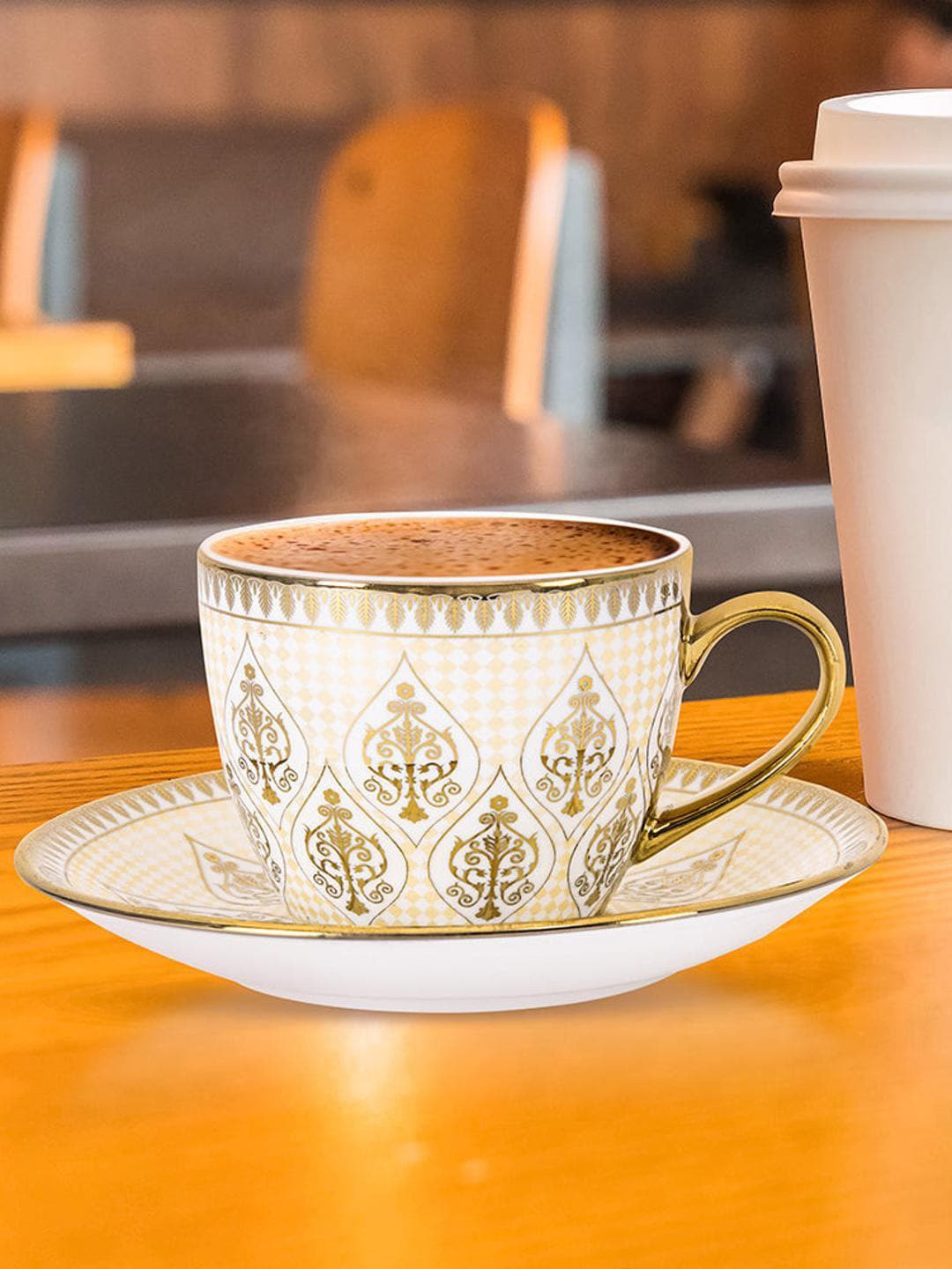 Athome by Nilkamal White & Gold-Toned 12-Pieces Printed Ceramic Glossy Cup & Saucer 200 ml
Athome by Nilkamal White & Gold-Toned 12-Pieces Printed Ceramic Glossy Cup & Saucer 200 ml