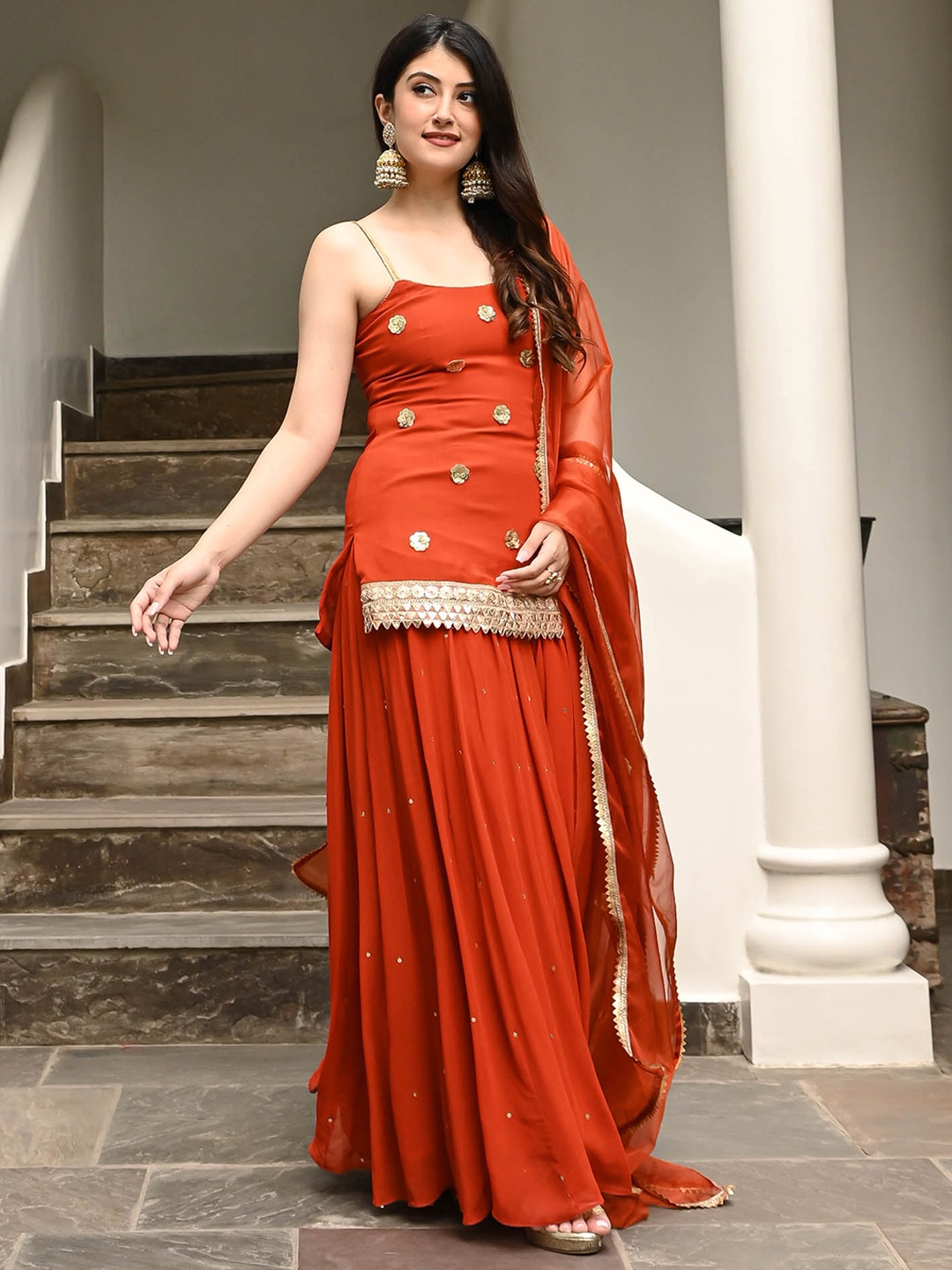 Urbanstree Embroidered Shoulder Strap Neck Sequinned Kurta with Sharara & With Dupatta, Orange
Urbanstree Embroidered Shoulder Strap Neck Sequinned Kurta with Sharara & With Dupatta, Orange