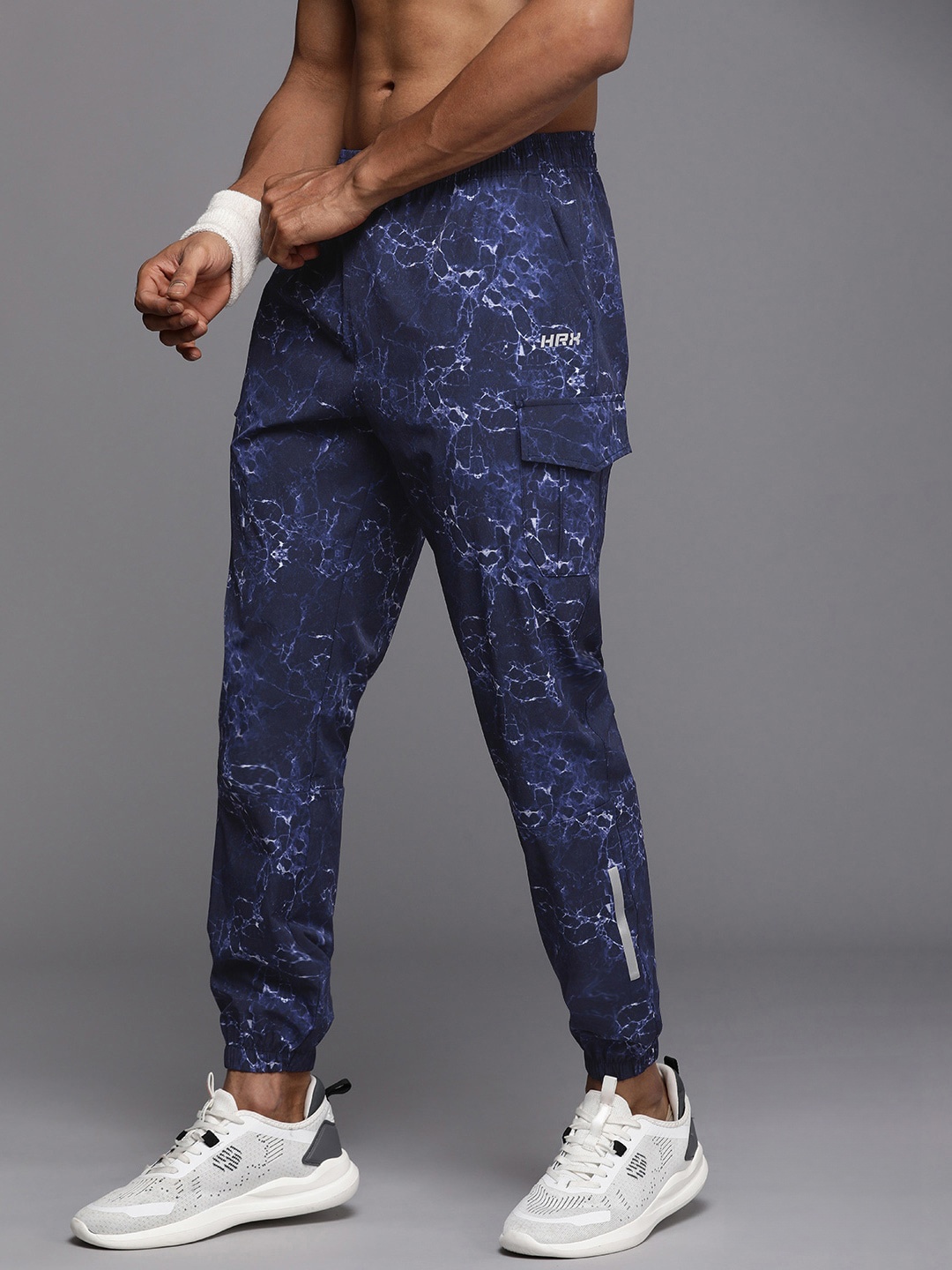 HRX By Hrithik Roshan Men Printed Rapid-Dry Training Joggers with Reflective Detail, Navy blue
HRX By Hrithik Roshan Men Printed Rapid-Dry Training Joggers with Reflective Detail, Navy blue