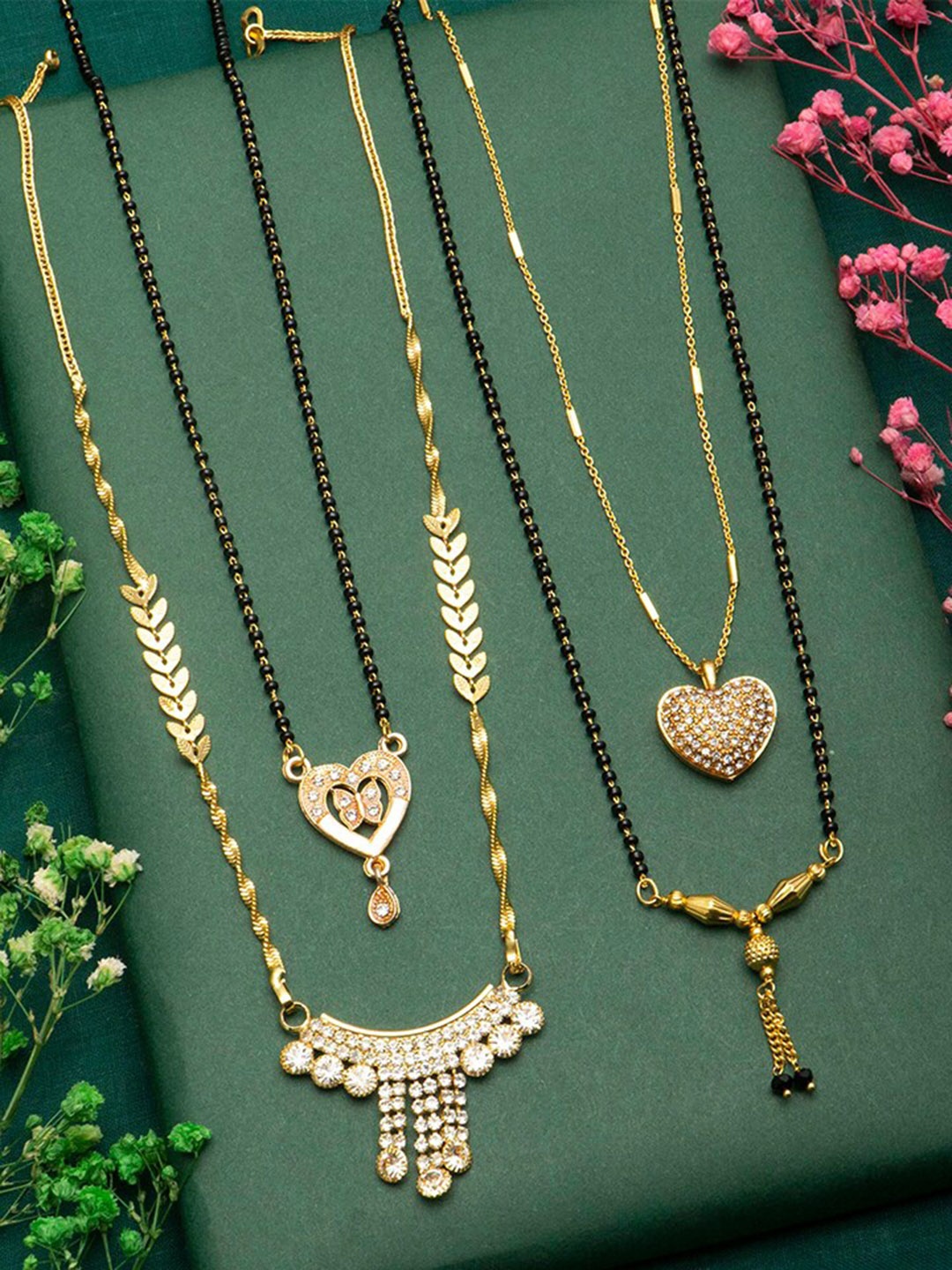Ramdev Art Fashion Jwellery Jewellery Set Of 4 Gold Plated Stone Studded Mangalsutra
Ramdev Art Fashion Jwellery Jewellery Set Of 4 Gold Plated Stone Studded Mangalsutra