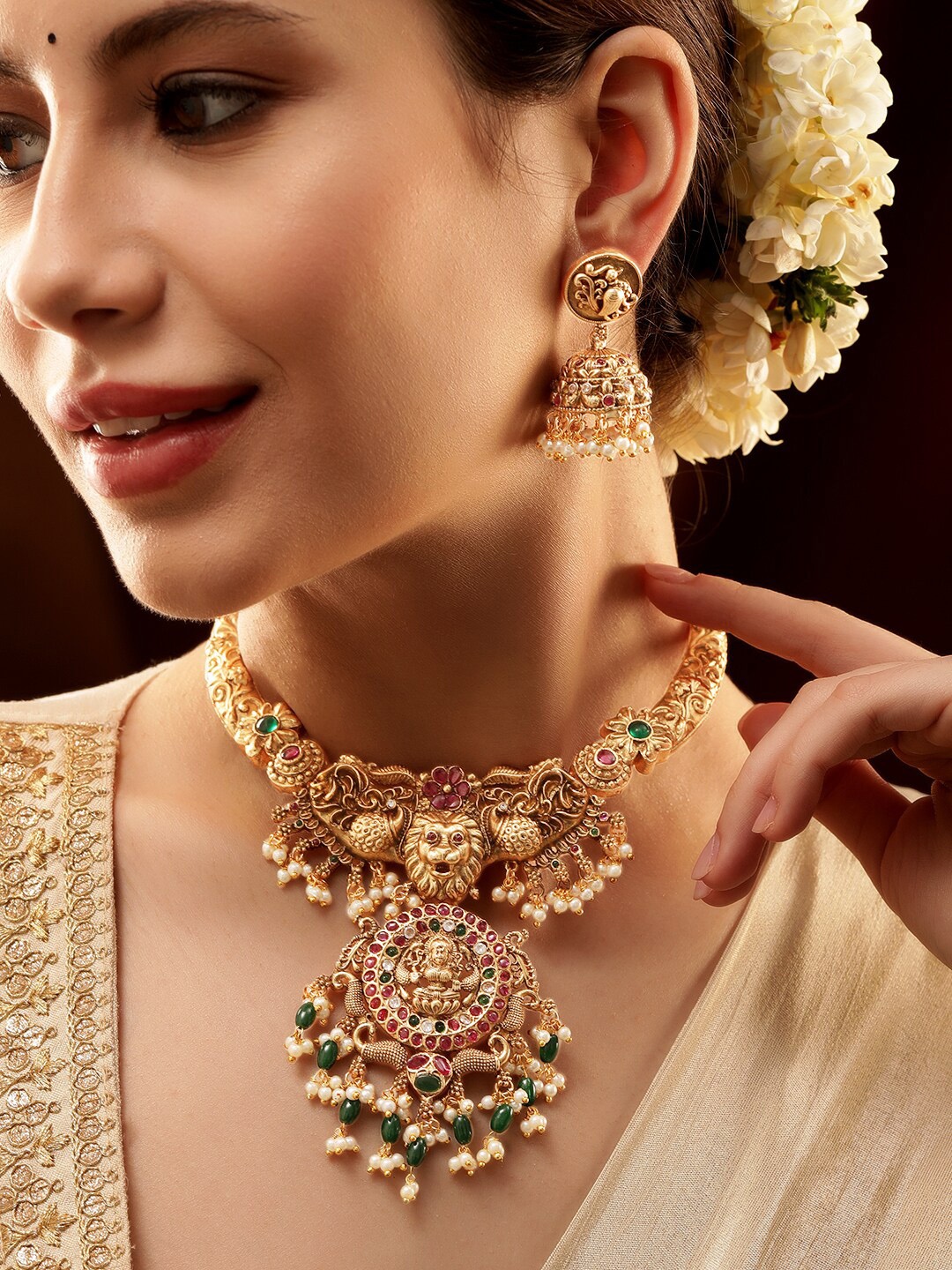 Rubans 22K Gold-Plated Lakshmi Motif Temple Jewellery Set with Ruby,Emerald Kundan & Pearl
Rubans 22K Gold-Plated Lakshmi Motif Temple Jewellery Set with Ruby,Emerald Kundan & Pearl