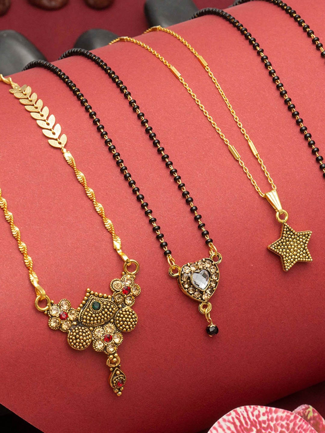 Ramdev Art Fashion Jwellery Set of 4 Gold-Plated Stone-Studded & Beaded Mangalsutra
Ramdev Art Fashion Jwellery Set of 4 Gold-Plated Stone-Studded & Beaded Mangalsutra