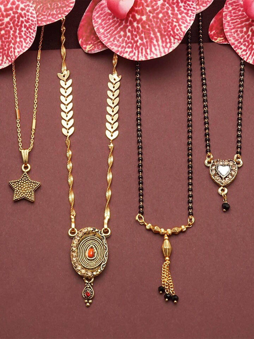 Ramdev Art Fashion Jwellery Set Of 4 Gold-Plated Stone-Studded & Beaded Mangalsutra
Ramdev Art Fashion Jwellery Set Of 4 Gold-Plated Stone-Studded & Beaded Mangalsutra