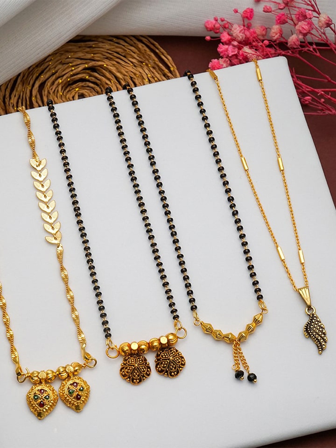 Ramdev Art Fashion Jwellery Set Of 4 Gold Plated Stones Studded & Beaded Mangalsutras
Ramdev Art Fashion Jwellery Set Of 4 Gold Plated Stones Studded & Beaded Mangalsutras