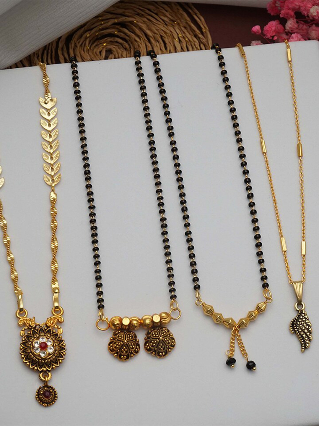 Ramdev Art Fashion Jwellery Set Of 4 Gold Plated Stone Studded & Beaded Mangalsutras
Ramdev Art Fashion Jwellery Set Of 4 Gold Plated Stone Studded & Beaded Mangalsutras