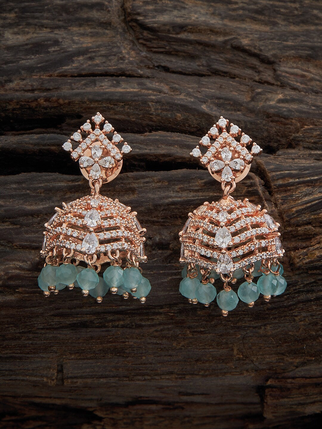 Kushal's Fashion Jewellery Rose Gold Plated Cubic Zirconia Studded Dome Shaped Jhumkas
Kushal's Fashion Jewellery Rose Gold Plated Cubic Zirconia Studded Dome Shaped Jhumkas