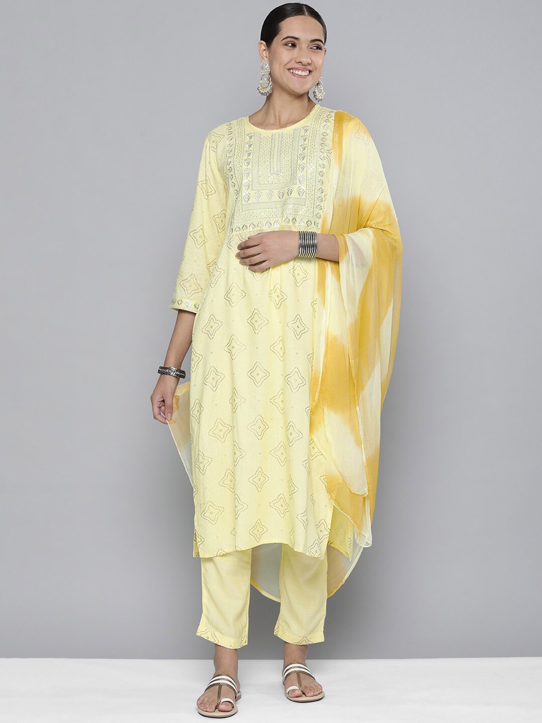 KALINI Ethnic Motifs Prinred Thread Work Detail Straight Kurta & Trousers With Dupatta, Yellow
KALINI Ethnic Motifs Prinred Thread Work Detail Straight Kurta & Trousers With Dupatta, Yellow
