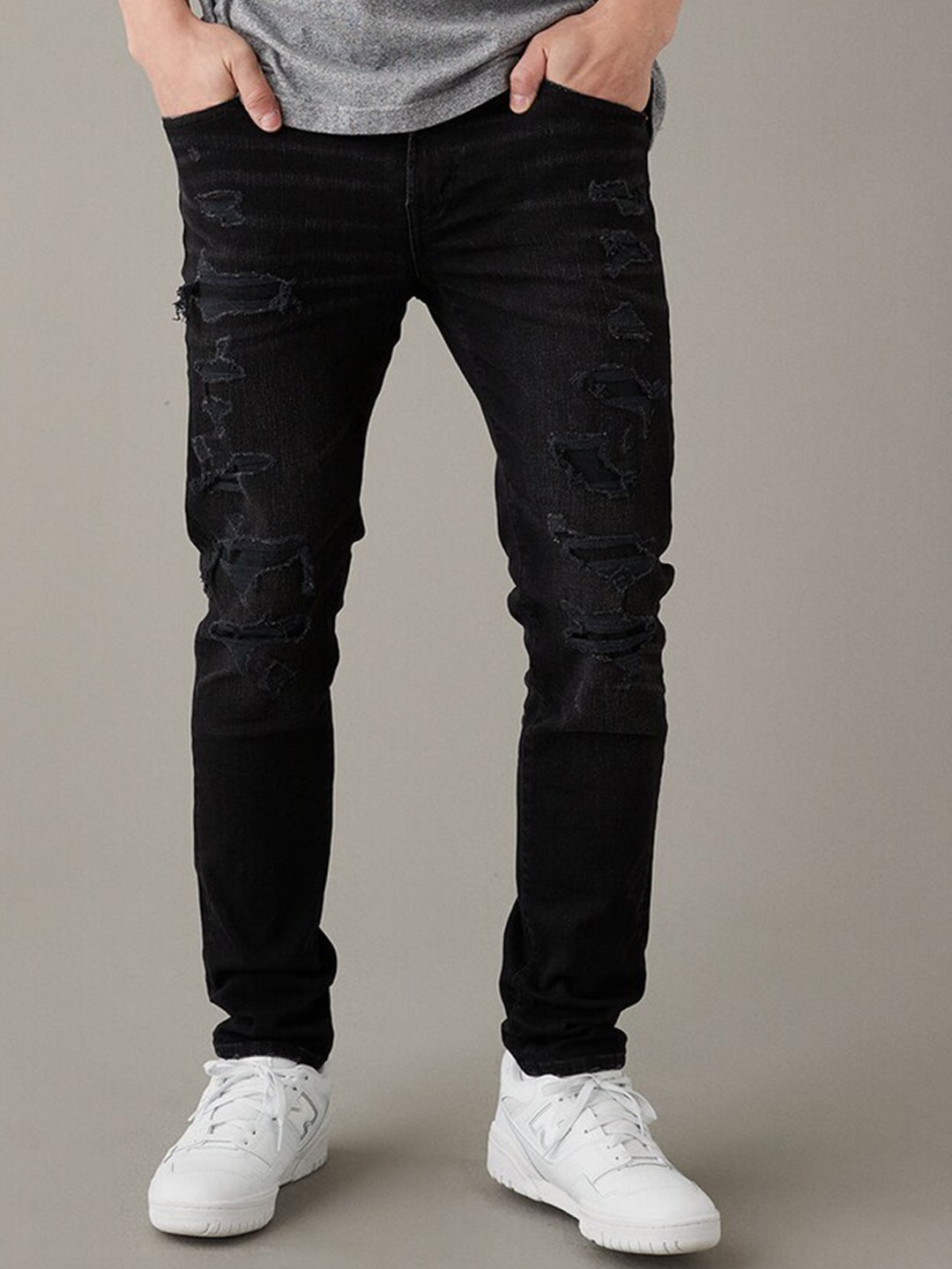 AMERICAN EAGLE OUTFITTERS Men Skinny Fit Mid-Rise Highly Distressed Stretchable Jeans, Black
AMERICAN EAGLE OUTFITTERS Men Skinny Fit Mid-Rise Highly Distressed Stretchable Jeans, Black