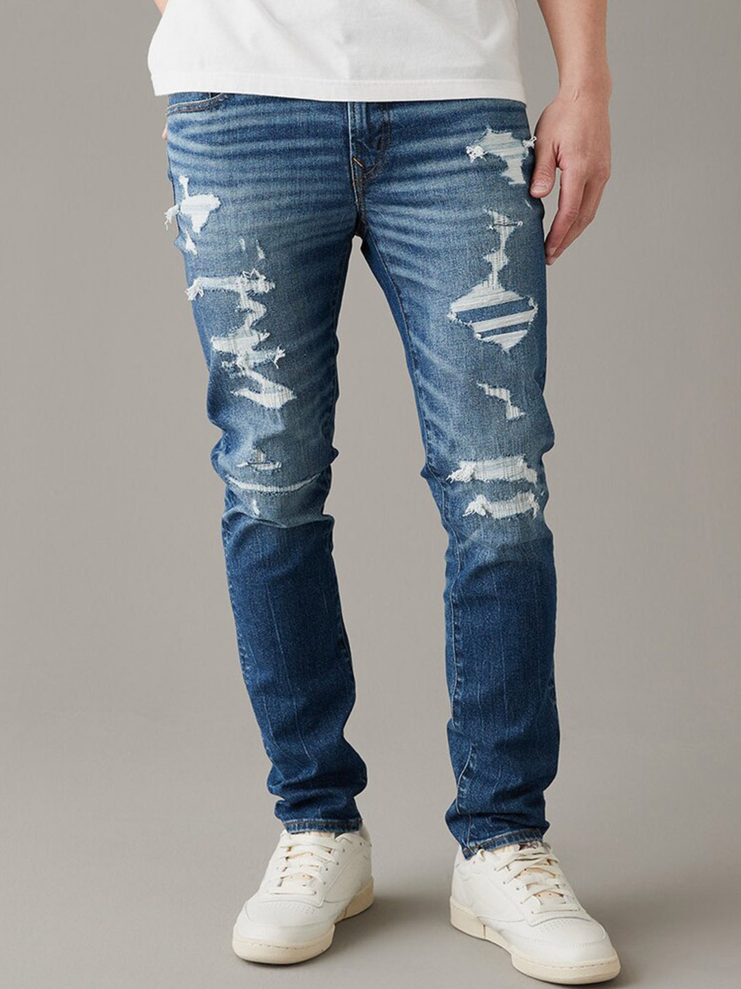 AMERICAN EAGLE OUTFITTERS Men Skinny Fit Highly Distressed Light Fade Stretchable Jeans, Blue
AMERICAN EAGLE OUTFITTERS Men Skinny Fit Highly Distressed Light Fade Stretchable Jeans, Blue