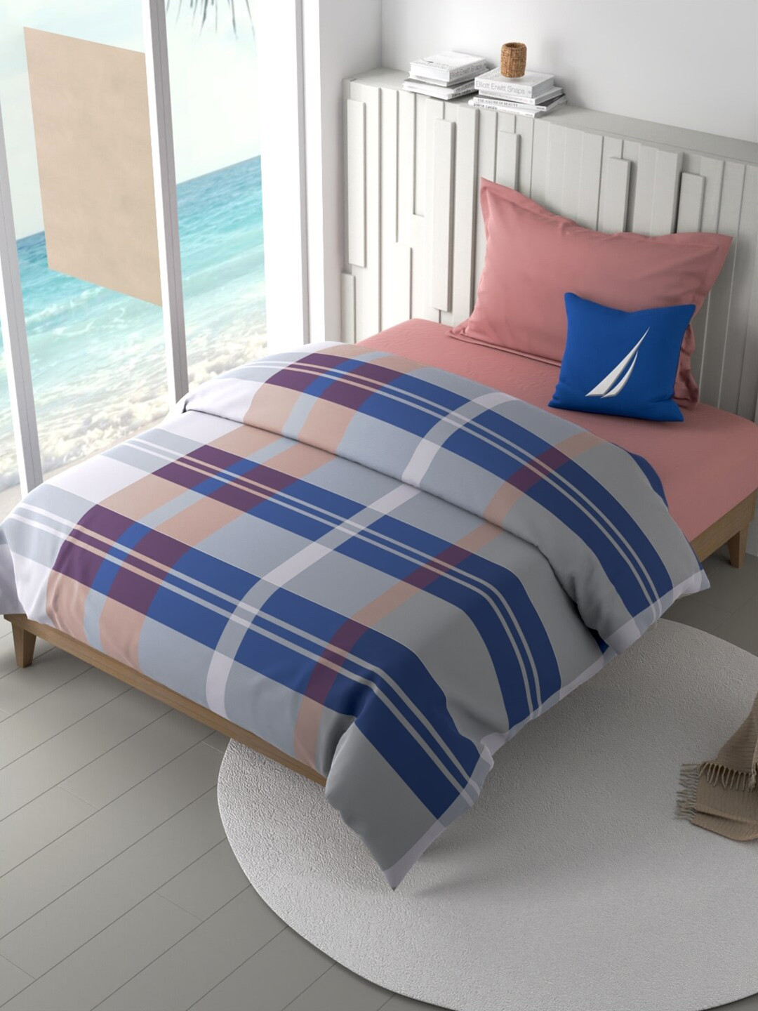 Nautica Ocean View Blue & Pink Checked Pure Cotton AC Room 180 GSM Single Bed Comforter
Nautica Ocean View Blue & Pink Checked Pure Cotton AC Room 180 GSM Single Bed Comforter