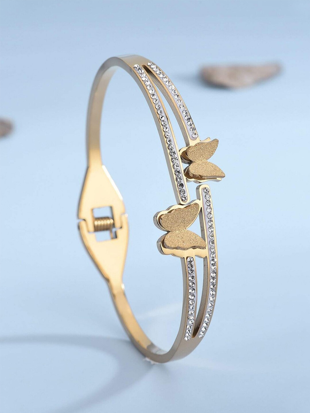 Jewels Galaxy Gold-Plated American Diamond Studded Stainless Steel Bangle-Style Bracelet
Jewels Galaxy Gold-Plated American Diamond Studded Stainless Steel Bangle-Style Bracelet