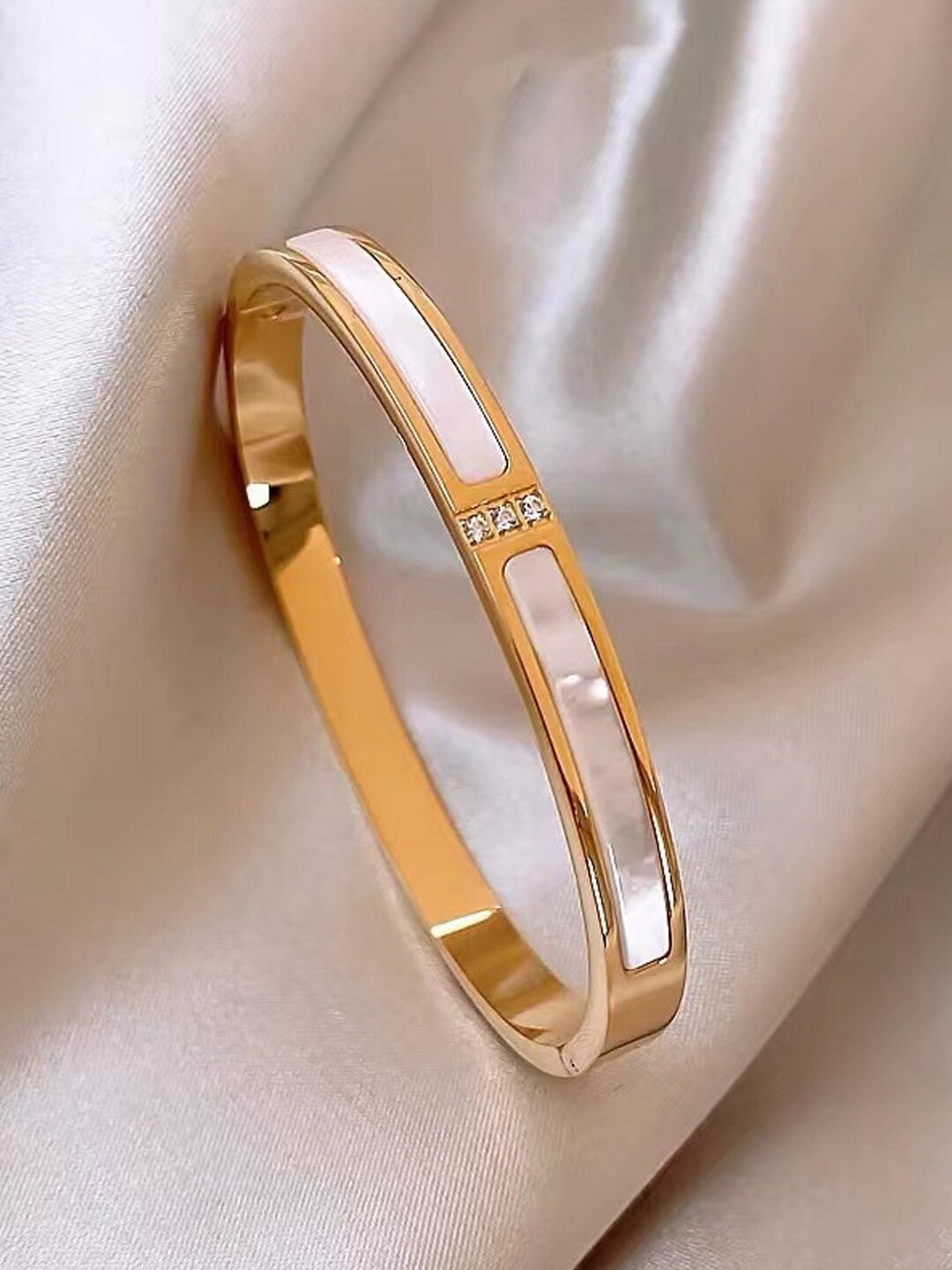 Jewels Galaxy Gold-Plated American Diamond Studded Stainless Steel Bangle-Style Bracelet
Jewels Galaxy Gold-Plated American Diamond Studded Stainless Steel Bangle-Style Bracelet