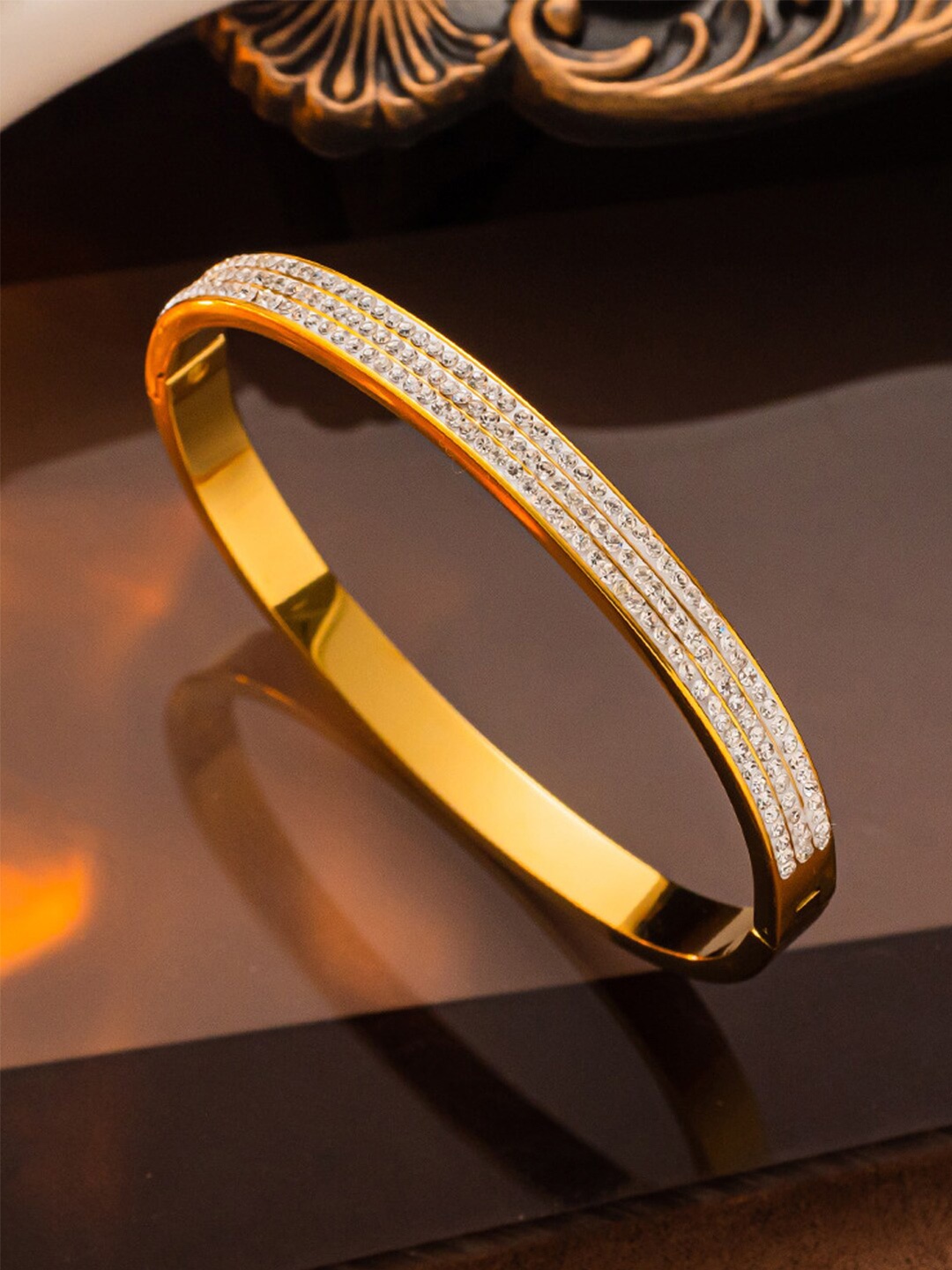 Jewels Galaxy Gold-Plated American Diamond Studded Stainless Steel Bangle-Style Bracelet
Jewels Galaxy Gold-Plated American Diamond Studded Stainless Steel Bangle-Style Bracelet