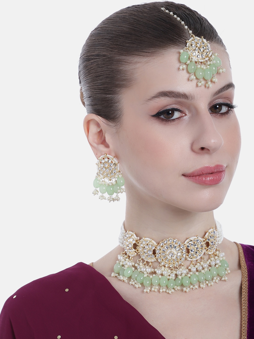 Estele Women Gold-Plated Kundan & Artificial Stones Studded & Beaded Choker Jewellery Set
Estele Women Gold-Plated Kundan & Artificial Stones Studded & Beaded Choker Jewellery Set
