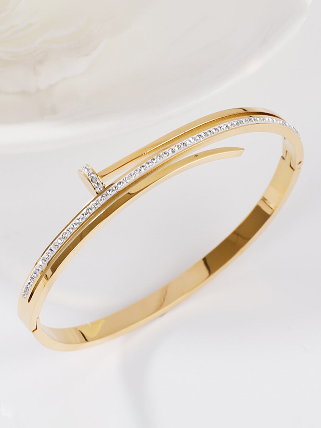 Designs & You Gold Plated Stainless Steel American Diamond Studded Bangle-Style Bracelet
Designs & You Gold Plated Stainless Steel American Diamond Studded Bangle-Style Bracelet