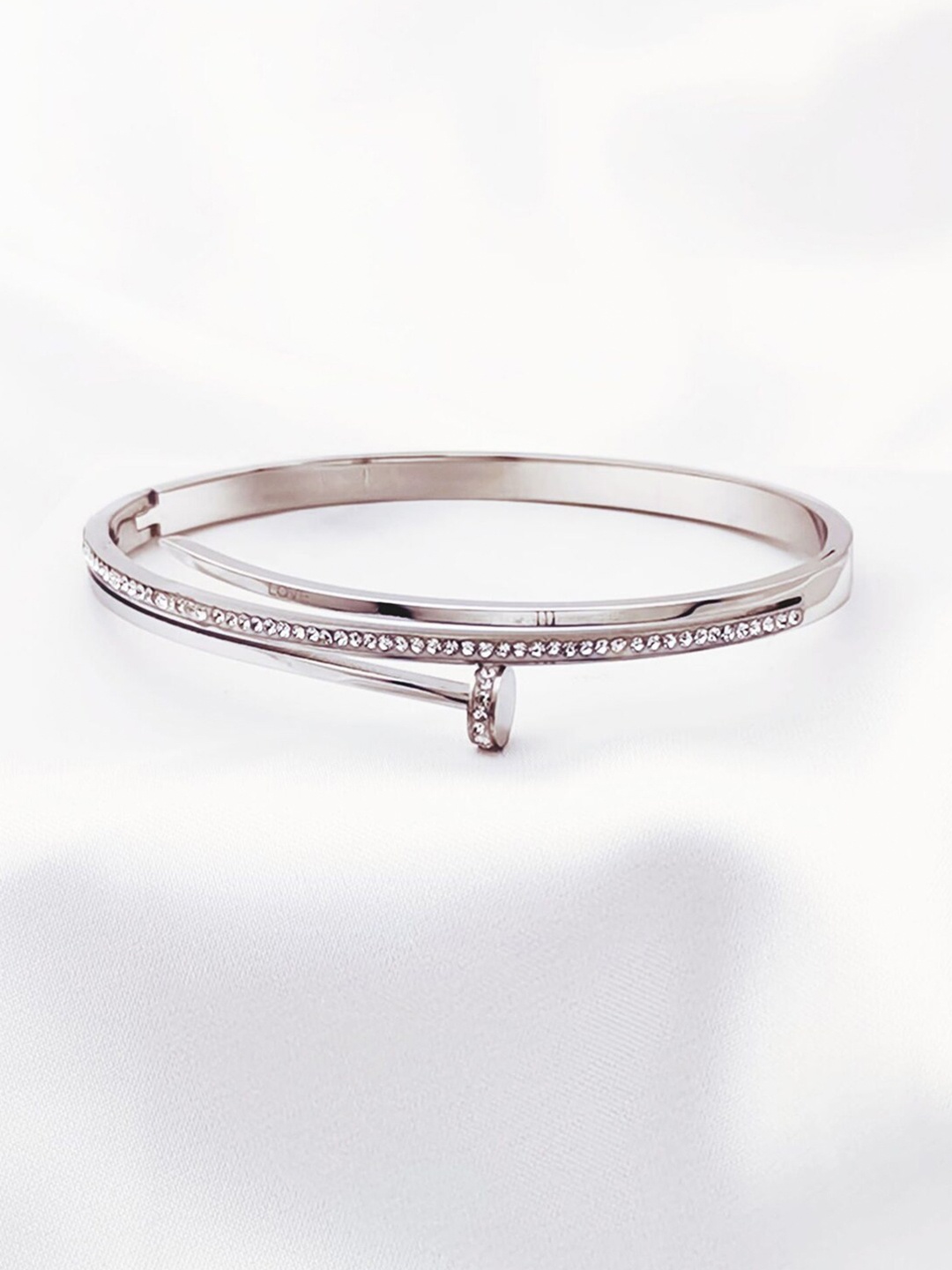 Designs & You Silver-Plated American Diamond Studded Stainless Steel Bangle-Style Bracelet
Designs & You Silver-Plated American Diamond Studded Stainless Steel Bangle-Style Bracelet