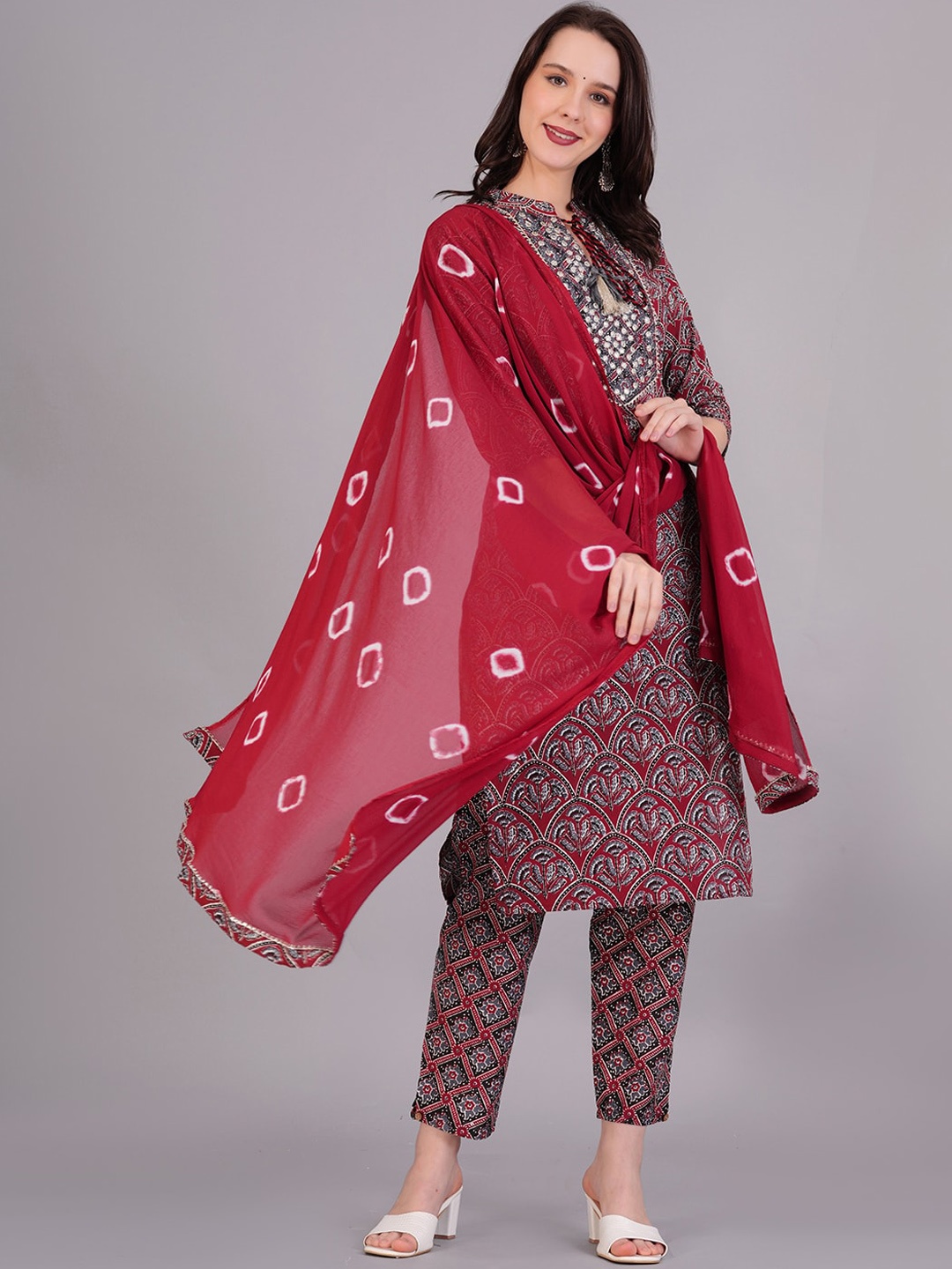 KALINI Ethnic Motifs Printed Tie-Up Neck Mirror Work Cotton Kurta & Trousers With Dupatta, Maroon
KALINI Ethnic Motifs Printed Tie-Up Neck Mirror Work Cotton Kurta & Trousers With Dupatta, Maroon