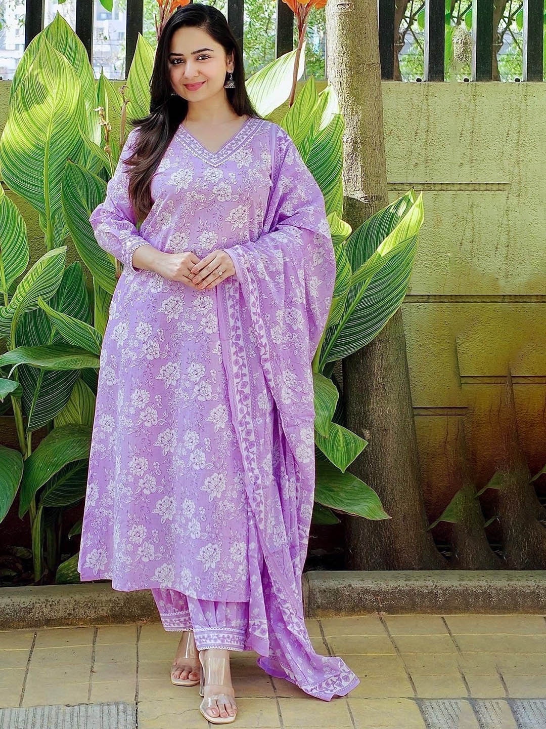 KALINI Floral Printed V-Neck Sequinned Pure Cotton Straight Kurta & Trousers With Dupatta, Purple
KALINI Floral Printed V-Neck Sequinned Pure Cotton Straight Kurta & Trousers With Dupatta, Purple