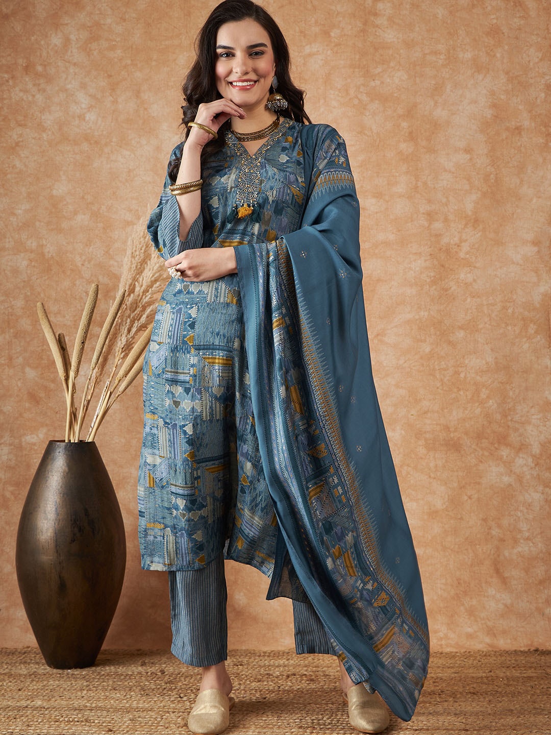 Vastramyaa Abstract Printed Beads and Stones Pure Silk Kurta with Trousers & Dupatta, Blue
Vastramyaa Abstract Printed Beads and Stones Pure Silk Kurta with Trousers & Dupatta, Blue