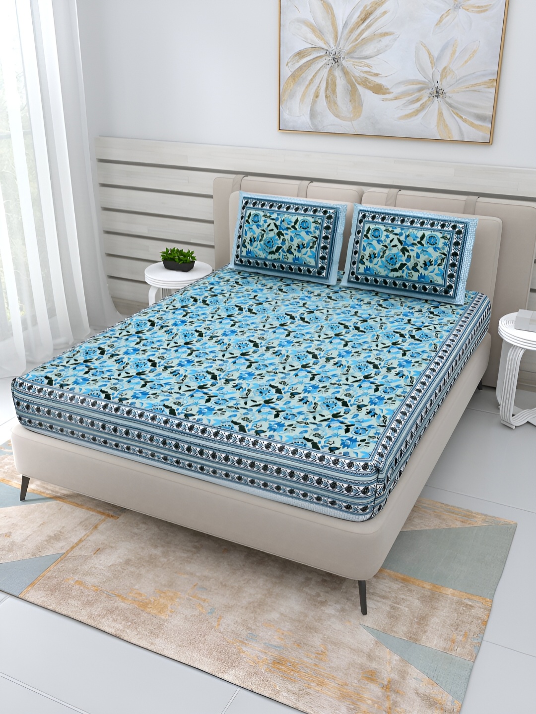 Wayne Martin Blue & Black Floral Cotton 210 TC Queen Bedsheet With 2 Pillow Covers
Wayne Martin Blue & Black Floral Cotton 210 TC Queen Bedsheet With 2 Pillow Covers