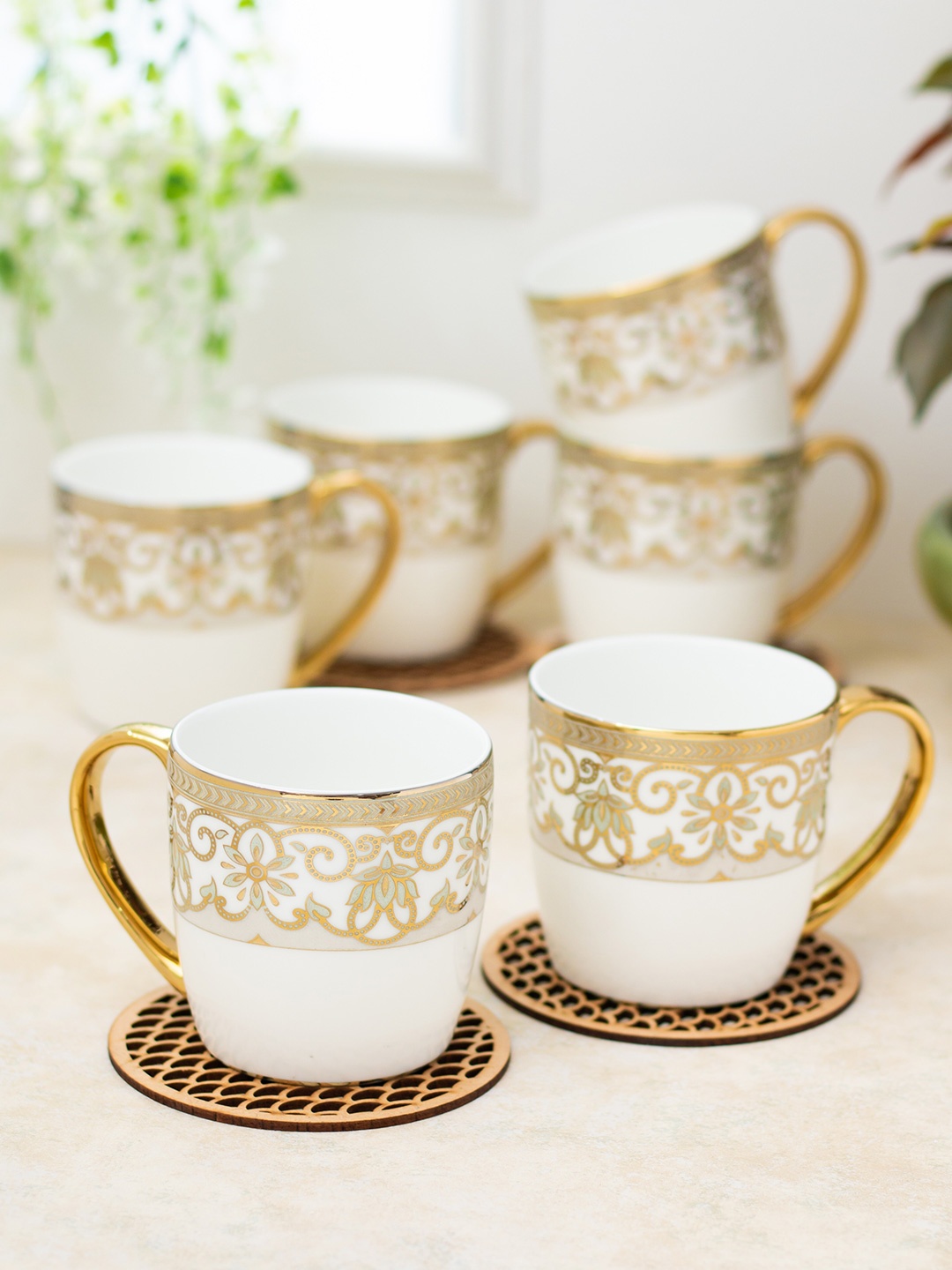 CLAY CRAFT White & Gold Toned 6 Pieces Ethnic Motifs Printed Ceramic Tea Cups 200ml
CLAY CRAFT White & Gold Toned 6 Pieces Ethnic Motifs Printed Ceramic Tea Cups 200ml