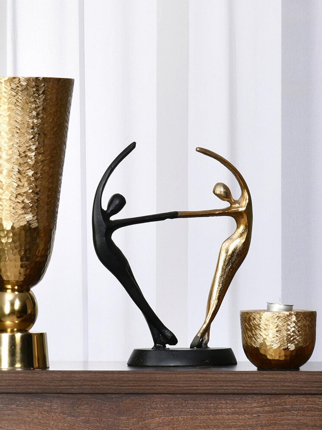 Athome by Nilkamal Black & Gold Toned Dancing Couple Textured Metal Figurine Showpiece
Athome by Nilkamal Black & Gold Toned Dancing Couple Textured Metal Figurine Showpiece