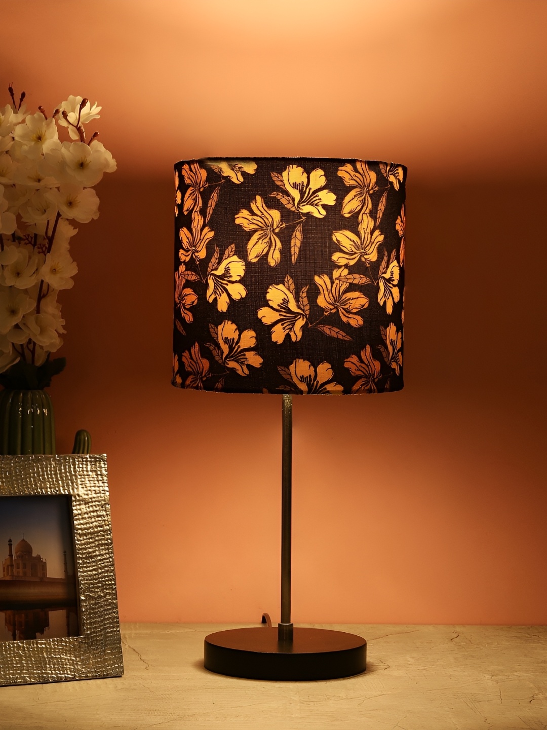 BTR CRAFTS Black & Gold Toned Floral Cylindrical Metal Table Lamp with Adjustable Cord
BTR CRAFTS Black & Gold Toned Floral Cylindrical Metal Table Lamp with Adjustable Cord