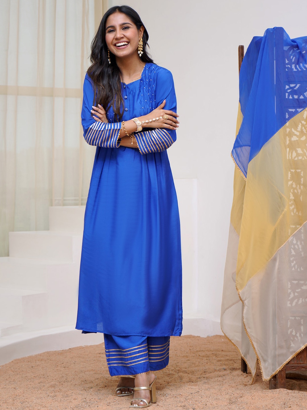 NERO Geometric Yoke Design Sequinned Chanderi Silk A Line Kurta With Trousers & Dupatta, Blue
NERO Geometric Yoke Design Sequinned Chanderi Silk A Line Kurta With Trousers & Dupatta, Blue