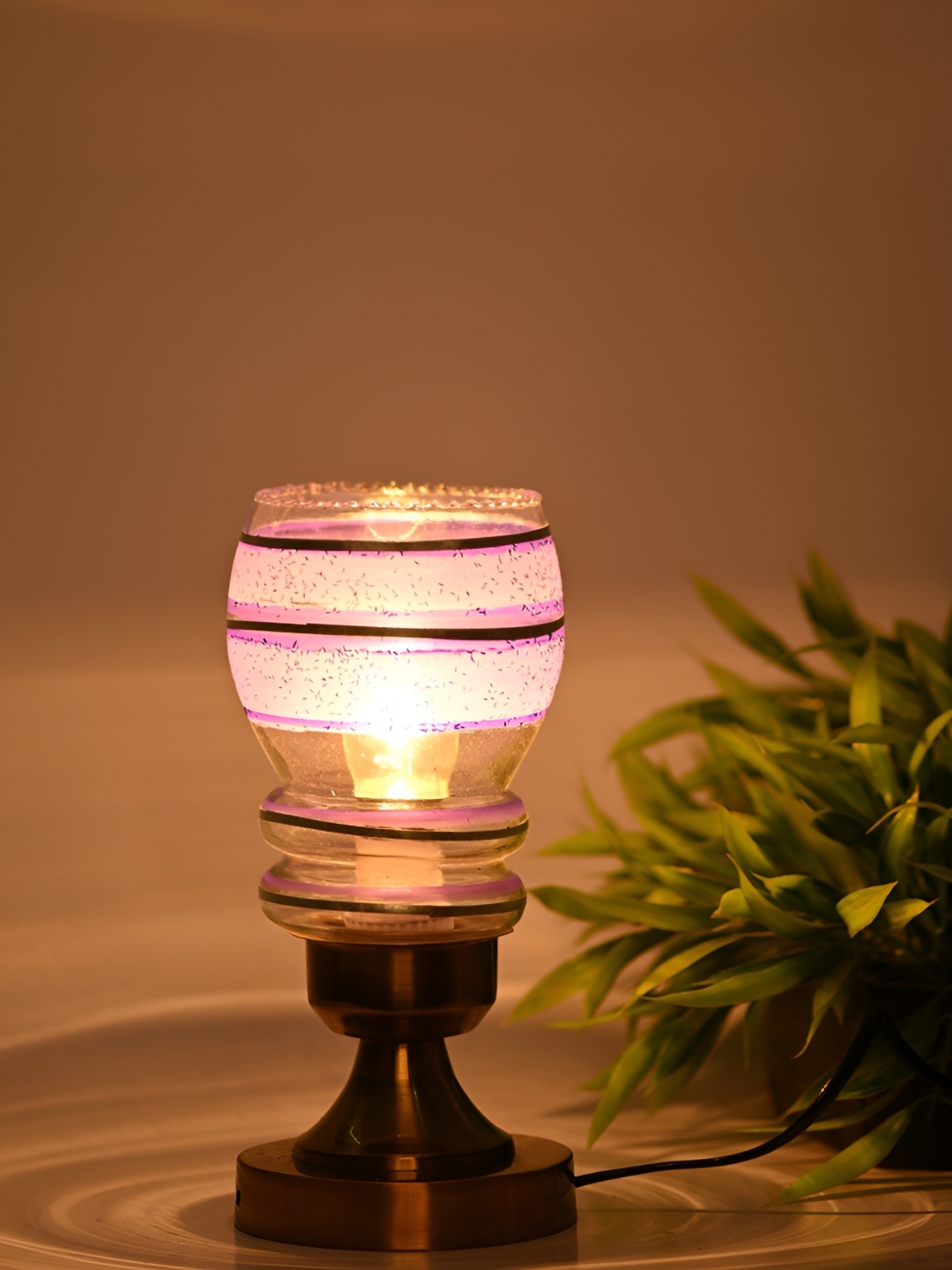 Afast Gold Toned & Purple Printed Abstract Shaped Glass Table Lamp with Adjustable Cord
Afast Gold Toned & Purple Printed Abstract Shaped Glass Table Lamp with Adjustable Cord