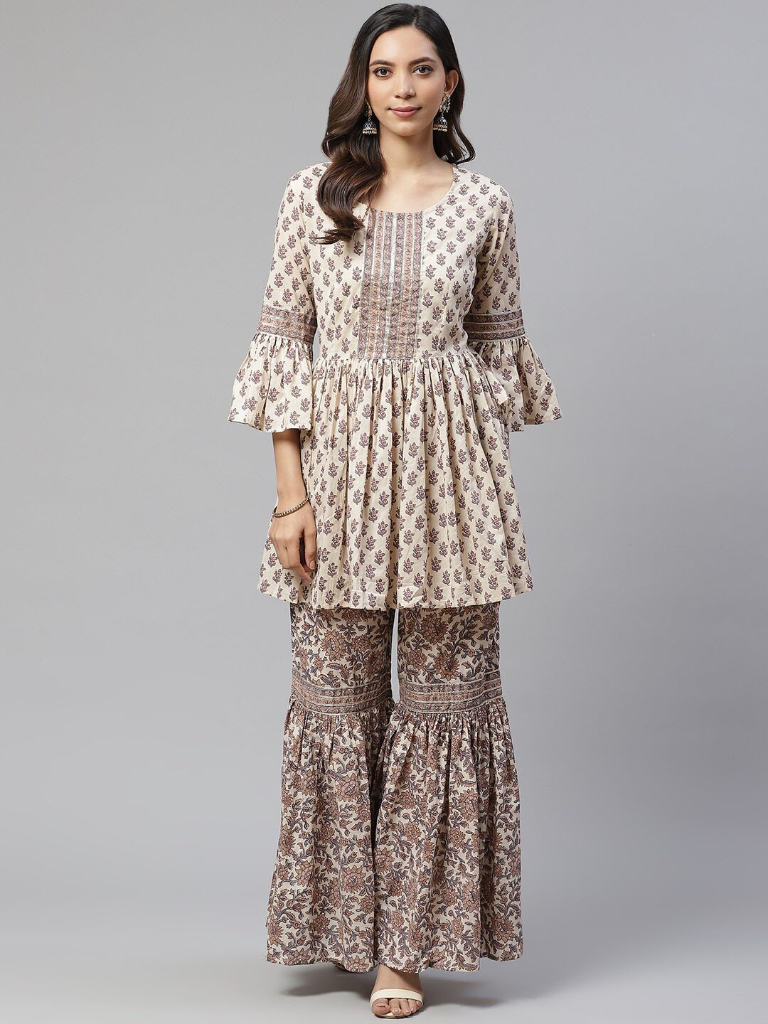 KALINI Floral Printed Bell Sleeves Gotta Patti Pure Cotton Kurta With Sharara, Cream
KALINI Floral Printed Bell Sleeves Gotta Patti Pure Cotton Kurta With Sharara, Cream