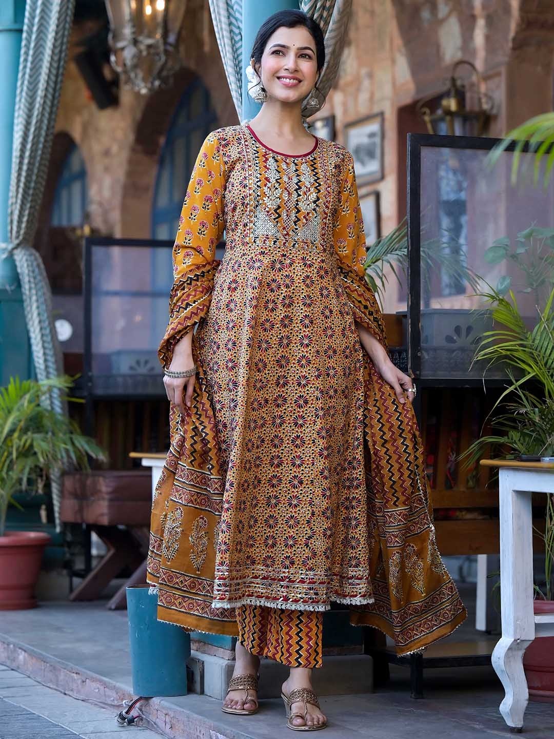 KALINI Floral Printed Thread Work Pure Cotton Anarkali Kurta With Trousers & Dupatta, Rust
KALINI Floral Printed Thread Work Pure Cotton Anarkali Kurta With Trousers & Dupatta, Rust