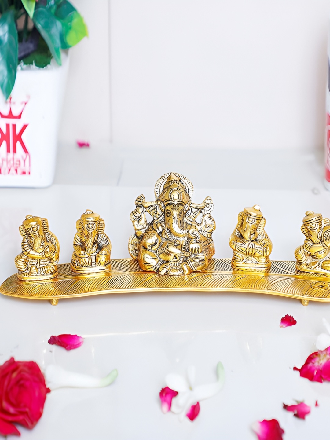 Kridaykraft Gold-Toned Metal Ganesh on Leaf with Musical Instrument Showpiece
Kridaykraft Gold-Toned Metal Ganesh on Leaf with Musical Instrument Showpiece