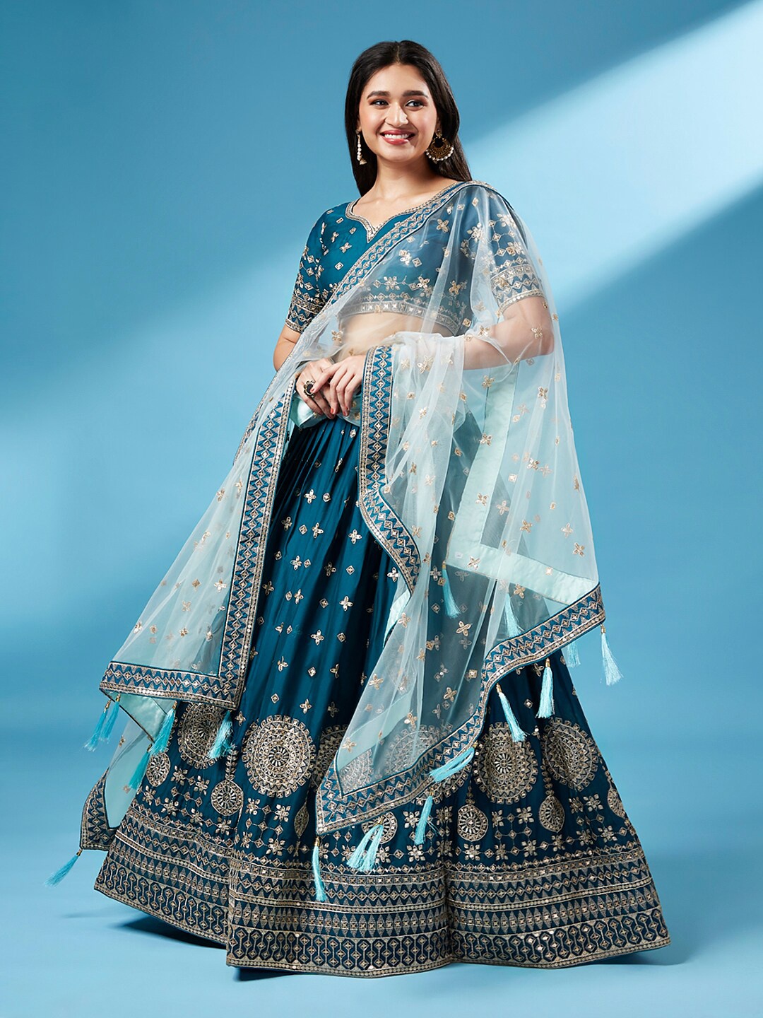 VAANI CREATION Embroidered Sequinned Semi-Stitched Lehenga & Blouse With Dupatta, Teal
VAANI CREATION Embroidered Sequinned Semi-Stitched Lehenga & Blouse With Dupatta, Teal