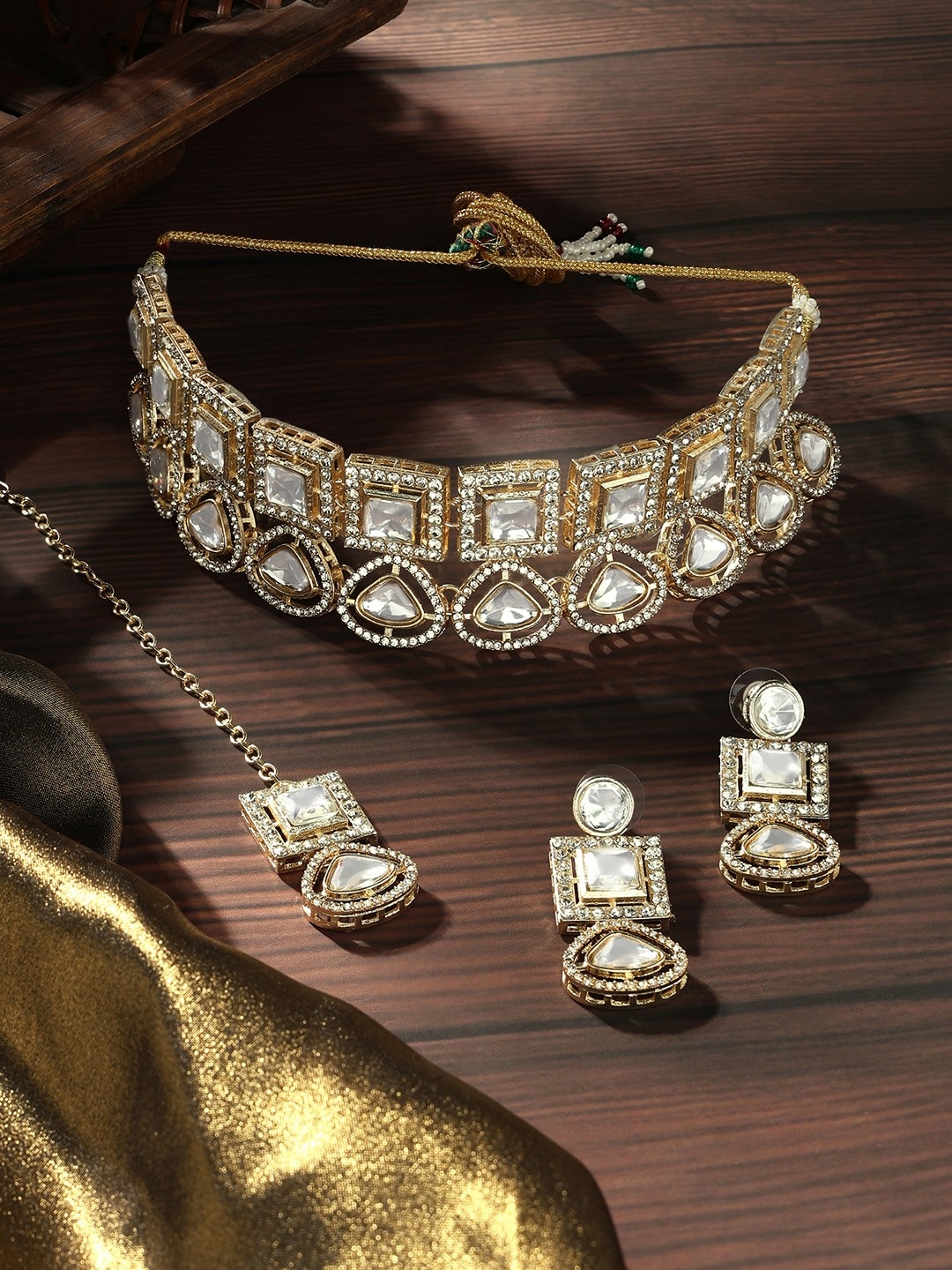 Zaveri Pearls Gold-Plated American Diamond-Studded Necklace And Earrings With Maang Tika
Zaveri Pearls Gold-Plated American Diamond-Studded Necklace And Earrings With Maang Tika