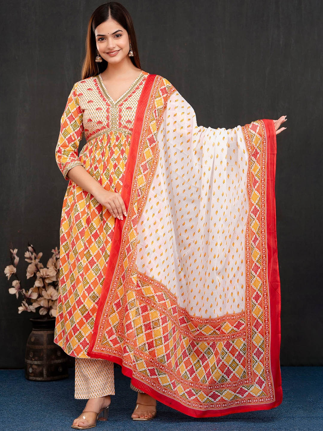 KALINI Ethnic Motifs Printed Empire Mirror Work Kurta With Trousers & Dupatta, Orange
KALINI Ethnic Motifs Printed Empire Mirror Work Kurta With Trousers & Dupatta, Orange