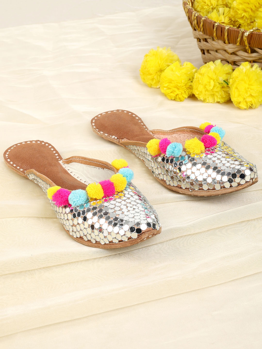 PehnawaCraft Silver Mirror & Pompom Embellished Leather Back open mojaris & Mules
PehnawaCraft Silver Mirror & Pompom Embellished Leather Back open mojaris & Mules