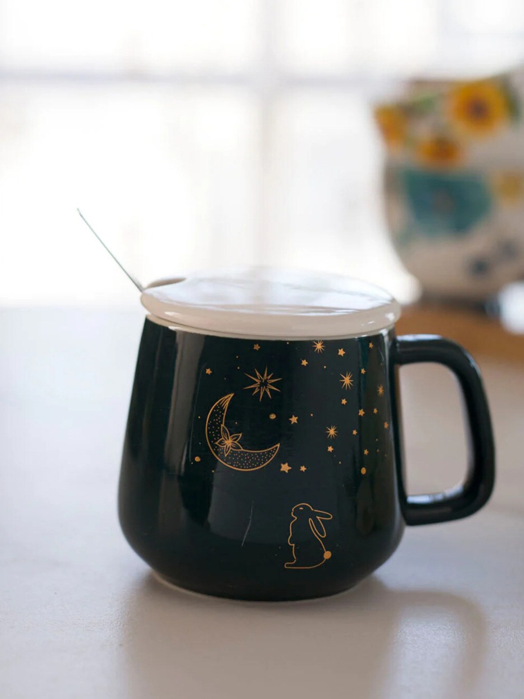 THEDECORKART Teal Blue and GoldToned 3 Pcs Printed Ceramic Mug with Lid & Spoon 300 ml
THEDECORKART Teal Blue and GoldToned 3 Pcs Printed Ceramic Mug with Lid & Spoon 300 ml
