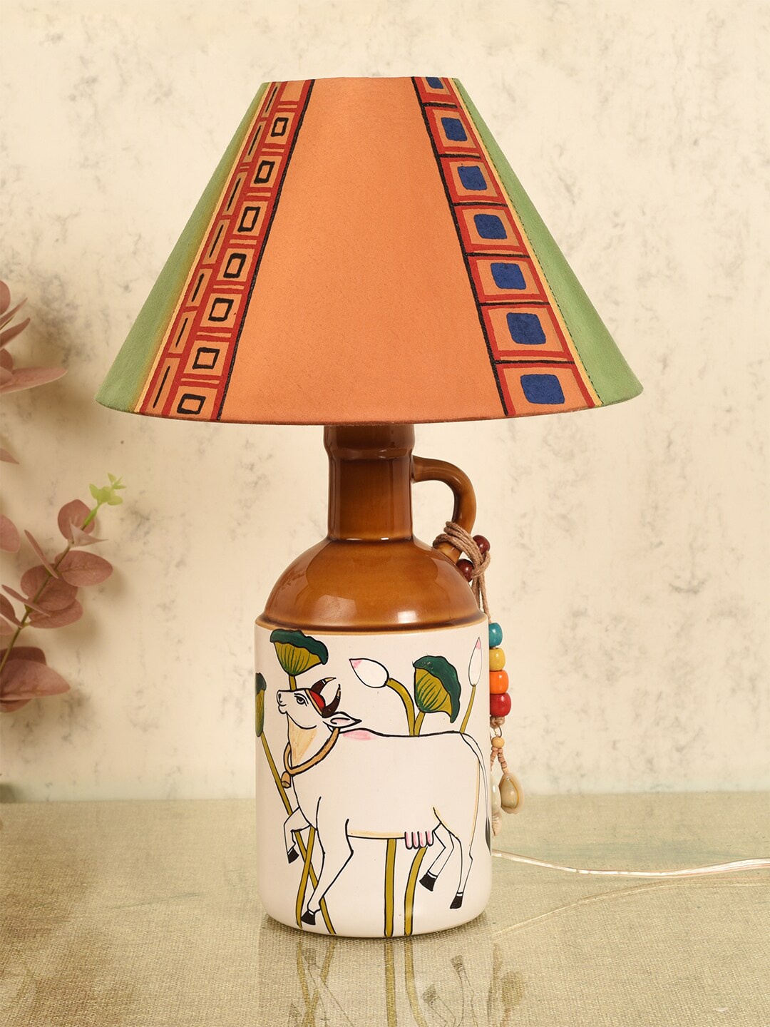 AAKRITI ART CREATIONS Orange Printed Ceramic Traditional Frusturical Shaped Table Lamp
AAKRITI ART CREATIONS Orange Printed Ceramic Traditional Frusturical Shaped Table Lamp